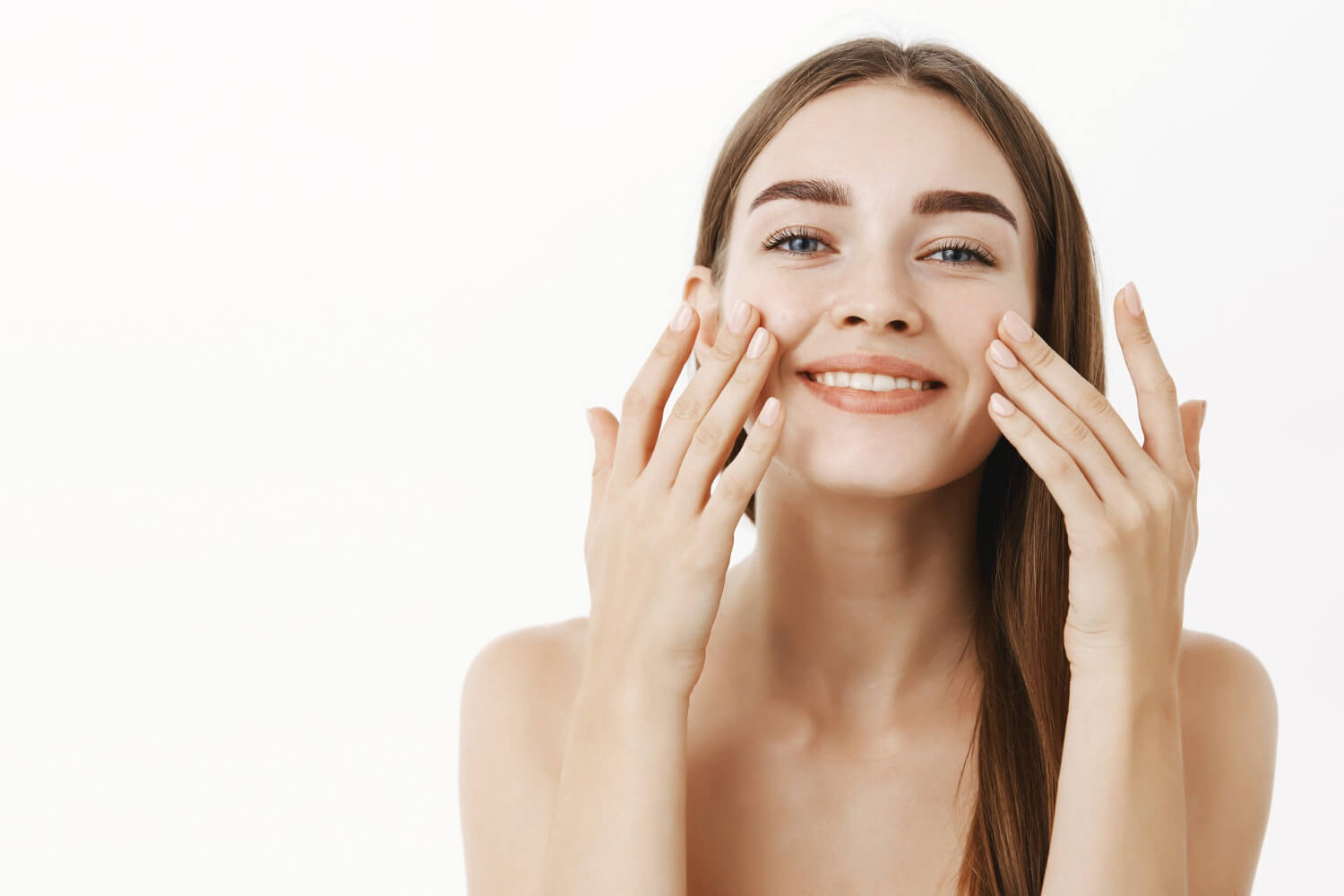 charming-relaxed-gentle-young-woman-making-cosmetological-procedure-applying-facial-cream-face-with-fingers-smiling-broadly-feeling-perfect-taking-care-skin (1)